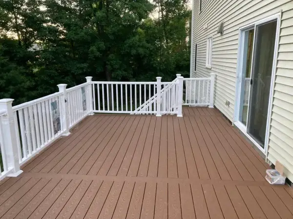 High-end residential deck with custom lighting and landscaping in Dover